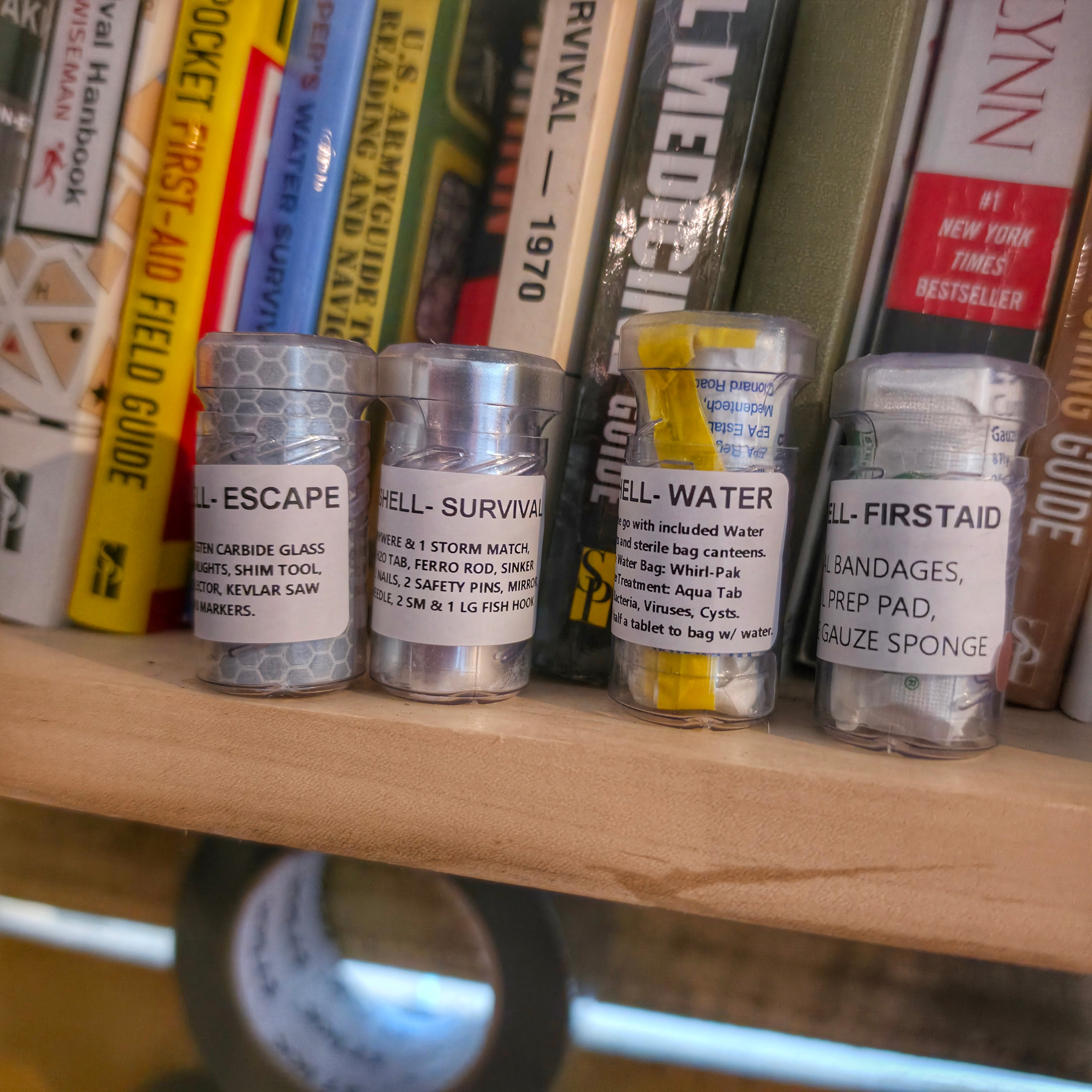 Drop Shell - Polymer Capsule filled with Survival, Escape, and First-Aid Supplies.